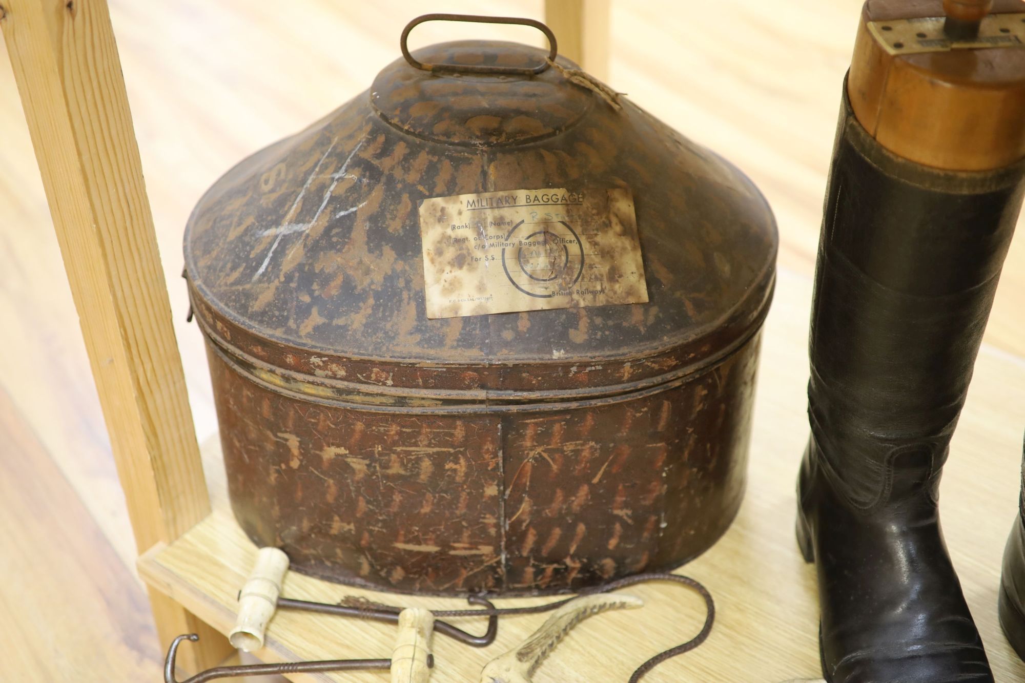 Two pairs of riding boots and trees together with two boot pulls and riding crops and a toleware hat box